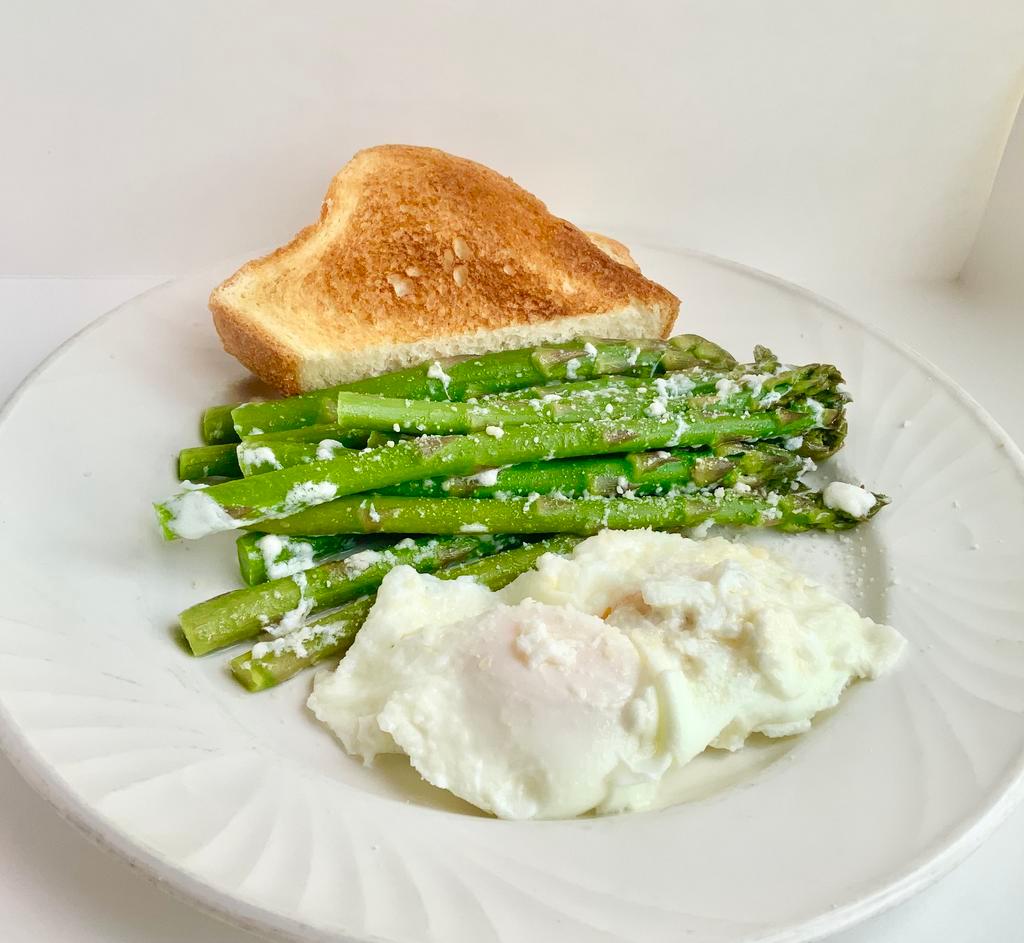 Asparagus and Eggs · 2 eggs poached on a bed of steamed asparagus, topped with grated cheese 