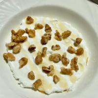 Yogurt with walnuts and honey · Non fat Greek yogurt topped with walnuts and honey