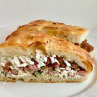 Sloppy Gino Sandwich · Shaved ricotta Salata and crumbled sausage topped with fresh ricotta.