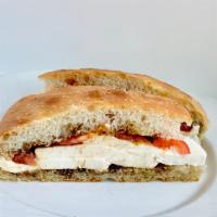 Tomato & Mozzarella Sandwich · Freshly sliced tomatoes, mozzarella cheese, balsamic glaze, and olive oil.