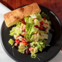 Garden Salad · Arugula with romaine lettuce, tomatoes, red onions, olives, and sweet peppers.