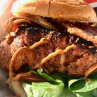 Blackened Salmon BLT · Blackened atlantic salmon filet over mixed greens & tomato topped with Virginia bacon and cr...