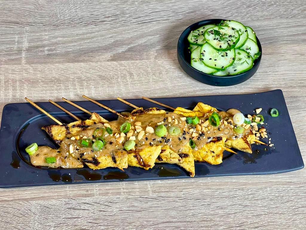 Grilled Chick'n Satay · Pickled cucumber salad, cilantro, crushed peanuts, spicy peanut butter dipping sauce