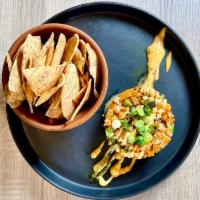 Spicy “Tuna” and Zalmon Tartare · Avocado, sesame, ginger, scallions, toasted cayenne sauce, taro root chips  