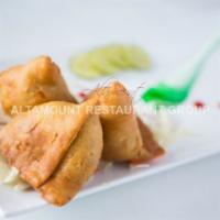 Samosa. · Crispy layers filled with potato and green pea filling.