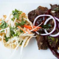 Goat Sukha · Dharani special. Goat with bone slow roasted in South Indian special spices.