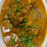 Chicken Curry (Chef's Special) · Chicken cooked in South Indian spicy gravy.