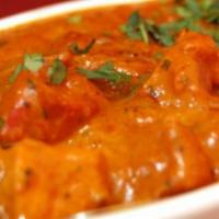 Butter Chicken. · Grilled chicken cooked in tomato gravy and creamy sauce.