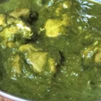 Chicken Saag. · Chicken cooked in spinach and spices.