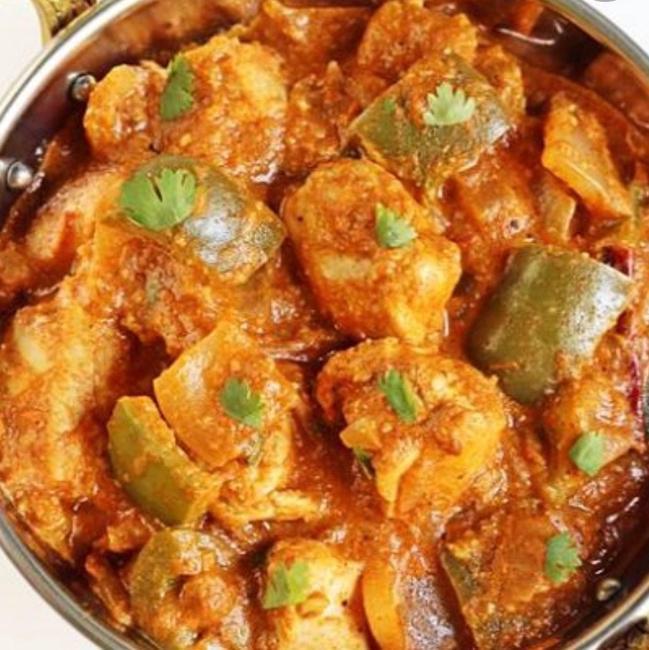 Kadai Chicken · Chicken cooked in green peppers tomatoes and onions.