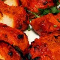 Chicken Tikka. · Boneless Chicken breast tender pieces spiced and grilled in tandoor oven.