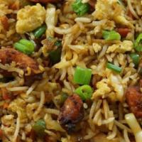 Chicken Fried Rice. · Chicken pieces with rice and mild spices.