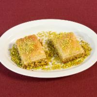 Pistachio Baklava (2 pc) · Layers of phyllo filled with chopped pistachios and butter held together with sugar syrup.