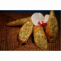 Springs Rolls · Golden veggie egg rolls filled with cabbage celery and carrots served with our orange ginger...