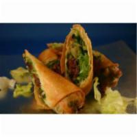 Beef Rolls · Beef rolls filled with celery, cilantro and green onions. Served with a peanut wasabi sauce.