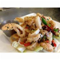 Sichuan Calamari · Tender calamari fried to perfection, tossed with garlic, ginger, whole chili and chopped jal...