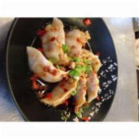Firecracker Dumplings · Pork and vegetable dumplings served with infused chili oil, crushed peanuts and bell peppers.