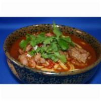 Spicy Beef Noodle Soup · A traditional Sichuan spicy noodle soup with large slices of beef, egg noodles and baby Boy ...