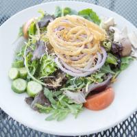 The Big House Salad · Mixed greens, shredded cheese, baby portabello mushrooms, thin-sliced red onions, cucumbers,...