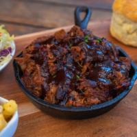 House Smoked Chopped Brisket · Beef Brisket cooked in our house made bbq sauce. Served with house Mac and cheese, homemade ...
