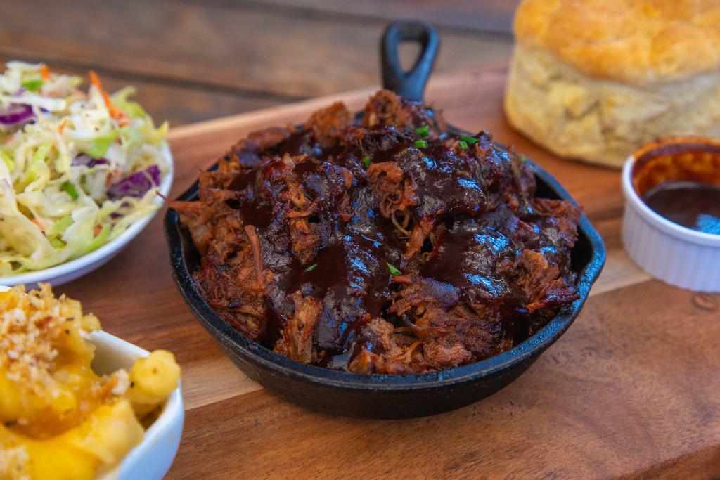 House Smoked Chopped Brisket · Beef Brisket cooked in our house made bbq sauce. Served with house Mac and cheese, homemade coleslaw and a fresh backed buttermilk biscuit. 