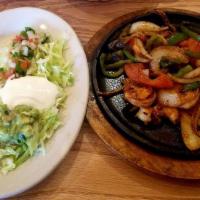 Shrimp Fajitas · 12 pieces delicious shrimp sauteed with onions, tomatoes, and peppers.