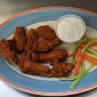 Buffalo Wings · Plump juicy wings with a  spicy coating, served with bleu cheese dressing.