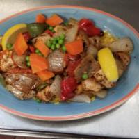 Marinated Chicken Shish Kabob · Marinated chicken breast with peppers, onions, tomatoes and mushrooms over rice. Served with...