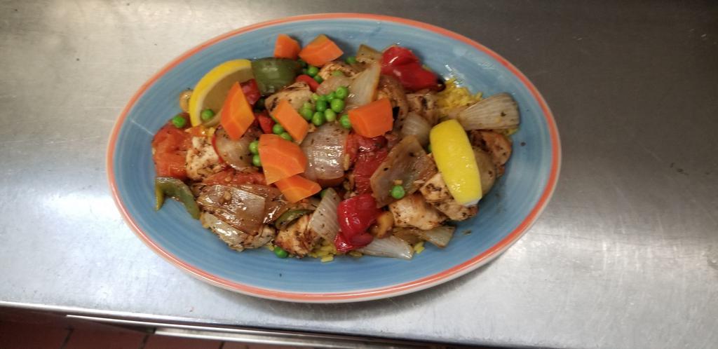 Marinated Chicken Shish Kabob · Marinated chicken breast with peppers, onions, tomatoes and mushrooms over rice. Served with your choice of season green salad or soup.
