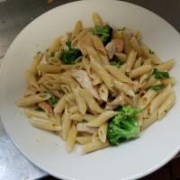 Fettuccine Alfredo · With broccoli in a Parmesan cream sauce. Served with your choice of season green salad or cu...