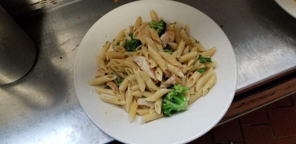 Fettuccine Alfredo · With broccoli in a Parmesan cream sauce. Served with your choice of season green salad or cup of soup.