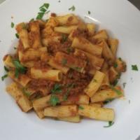 Rigatoni Bolognese · With our own classic meat sauce. Served with your choice of season green salad or cup of soup.