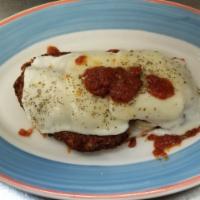 Chicken Cutlet Parmigiana · Golden brown chicken breast with mozzarella cheese, marinara sauce and pasta. Served with yo...