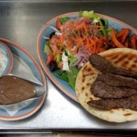 Gyro Platter · Served with pita bread and tzatziki sauce with french fries and Greek salad.