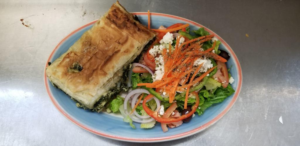 Greek spinach pie · Spinach feta and dill nestled in Filo.served with greek salad