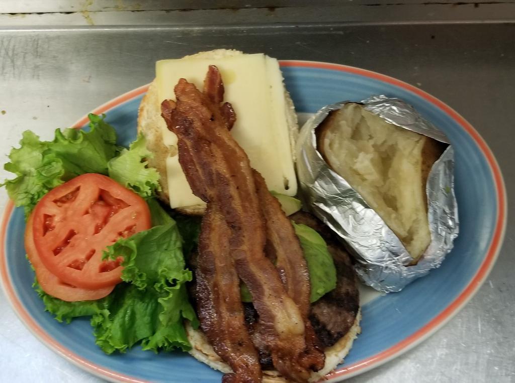 California Burger · Served with Haas avocado, bacon, Swiss cheese and ranch dressing. Deluxe is served french fries, lettuce, tomato, coleslaw and pickle.