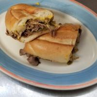 Philly Cheese Steak · Served with coleslaw and pickle.
