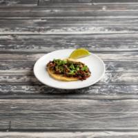 Spicy Beef Short Rib Taco · Seared shredded short rib, onion, cilantro and spicy Thai sauce (sweet and spicy chili sauce...