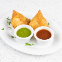 1. Samosa · Fried pastry stuffed with spiced potato and green peas.