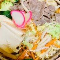 Beef Udon Noodle Soup · Served with salad.