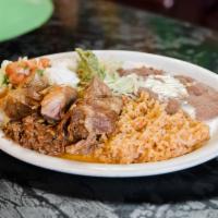 20. Carnitas · Flour or corn tortillas, pork tips wit rice, beans and salad with tortillas. (Red sauce or g...