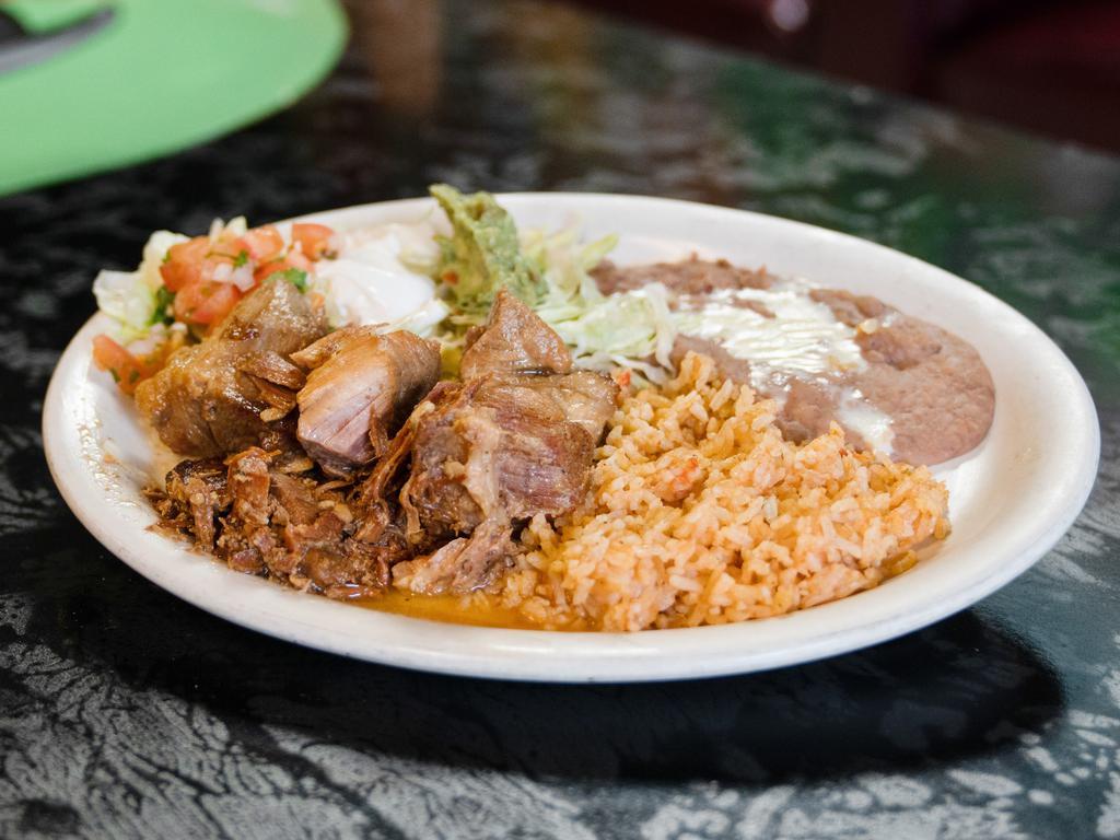 20. Carnitas · Flour or corn tortillas, pork tips wit rice, beans and salad with tortillas. (Red sauce or green sauce available).