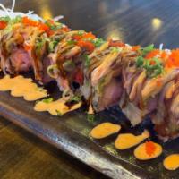 Tinker bell roll · Inside: shrimp tempura,lobster salad 
Outside: avocado, kani, eel sauce ,spicy mayo,tobiko