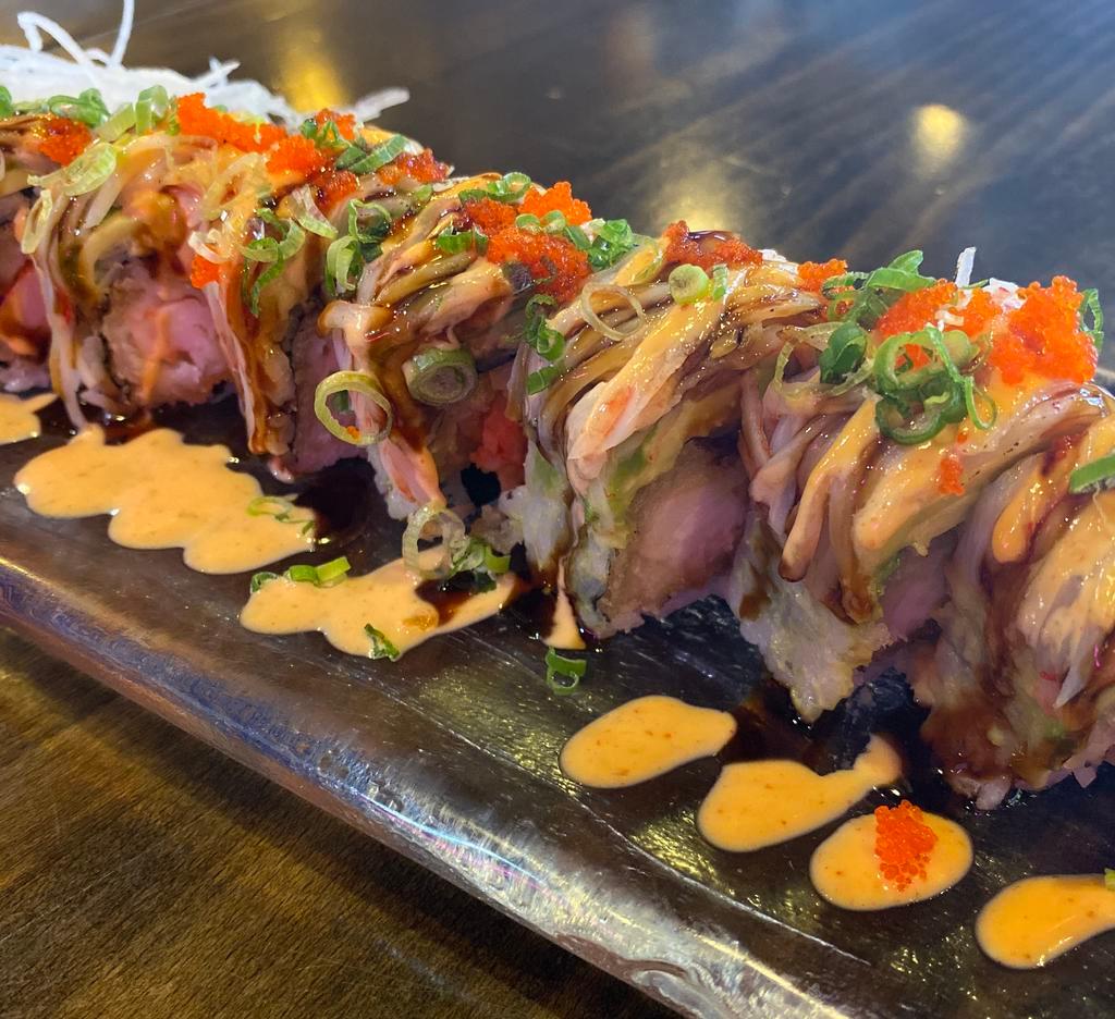 Tinker bell roll · Inside: shrimp tempura,lobster salad 
Outside: avocado, kani, eel sauce ,spicy mayo,tobiko