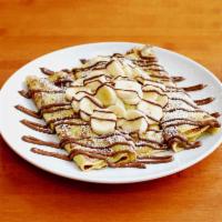 Nutella Banana Crepes · Fresh sliced bananas rolled into 3 crepes. Topped with a rich Nutella spread. Delicate Frenc...