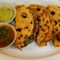 Beef Birria Tacos (3) · comes with 3 beef birria tacos on corn tortillas and side of  Consome.