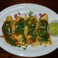 Chicken Canasta Tacos (4) · 4 chicken tacos on soft streemed corn tortillas, topped with salsa verde, Chili Oil, onions,...