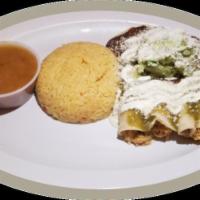 Enchiladas · Mole and salsa verde enchiladas topped with crema, cotija cheese and guacamole. Served with ...