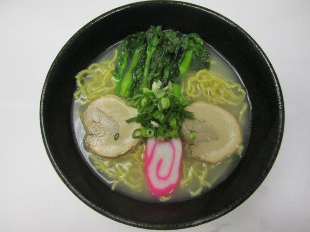 Shio Ramen  · Clear broth with salt with 2 pieces char siu, 1 piece of fish cake, choy sum, and green onion. 