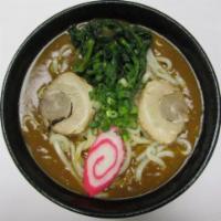 Curry Udon  · Golden curry sauce in soup with 2 pieces char siu, 1 piece fish cake, choy sum, and green on...